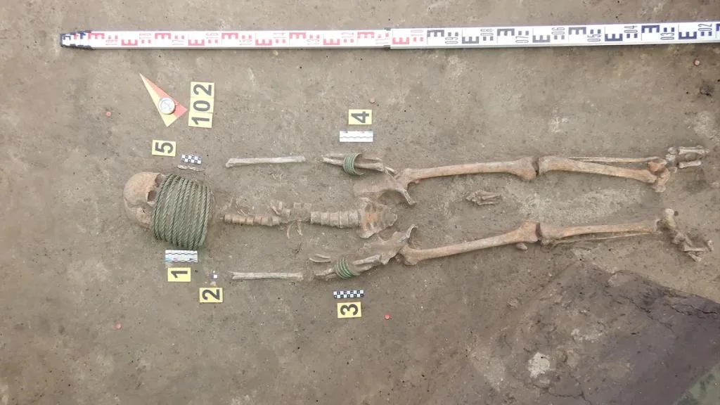 1,000-year-old cemetery with dead wearing elaborate neck rings and buckets on their feet unearthed in Ukraine