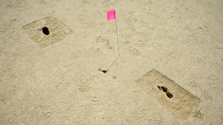 Footprints discovered on an archaeological site are marked with a pin flag on the Utah Test and Training Range, July 18, 2022. In compliance with Section 106 of the National Historic Preservation Act, the Air Force works closely with the Utah State Historic Preservation Office to explore, discover, and preserve historical and cultural artifacts on the UTTR.