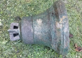 Buried church bell found in Poland after decades hidden beneath roadside