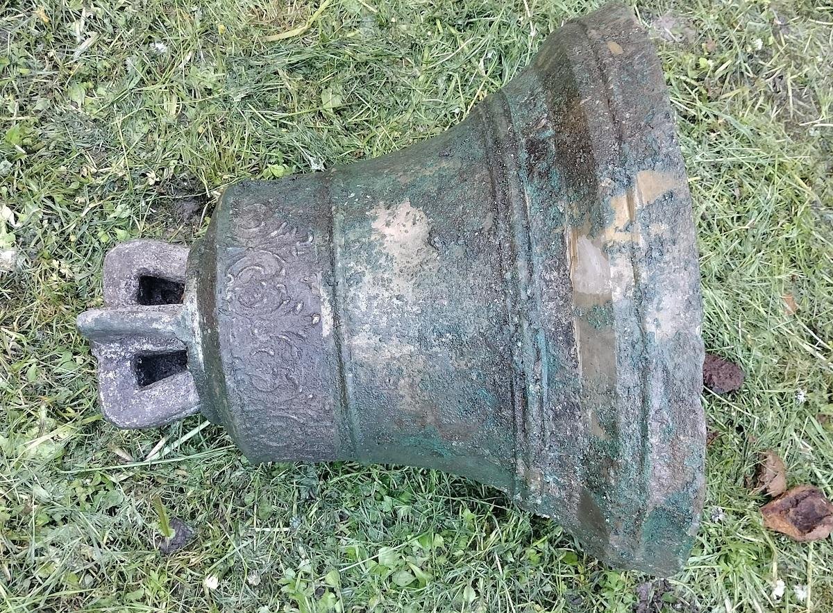 Buried church bell found in Poland after decades hidden beneath roadside