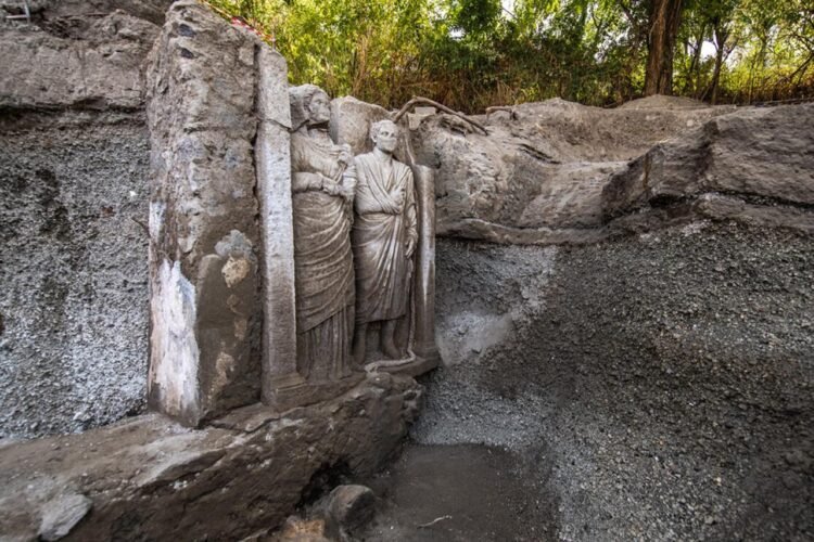 Two nearly life-size funerary sculptures uncovered in Pompeii tomb