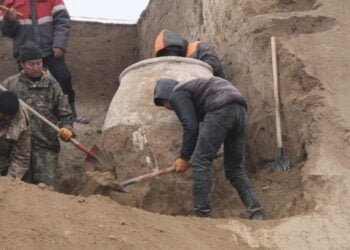 Archaeologists unearth a large clay vessel in Kyrgyzstan