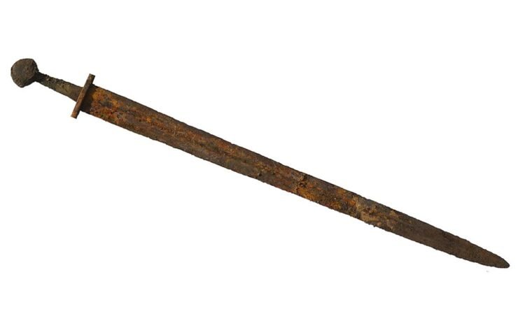 A complete earlier medieval (probably circa 12th century) iron sword. Credit: Suffolk County Council, Dr Anna Booth / CC BY 2.0