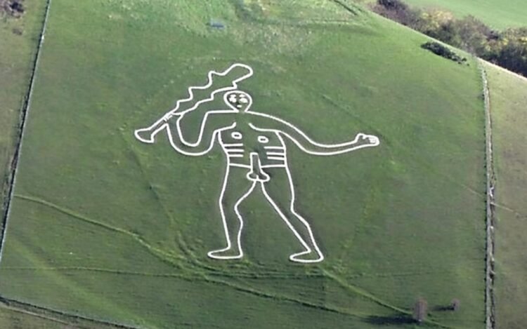 Volunteers restore England’s mysterious Cerne Abbas Giant as climate and erosion threaten ancient landmark